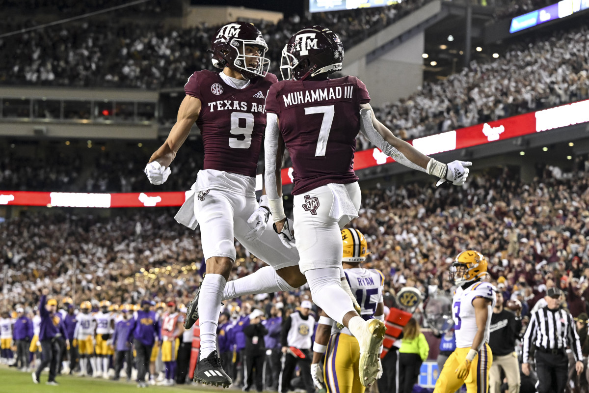 Texas A&M football players celebrate a touchdown.
